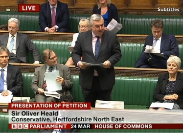 Sir Oliver presenting the petition